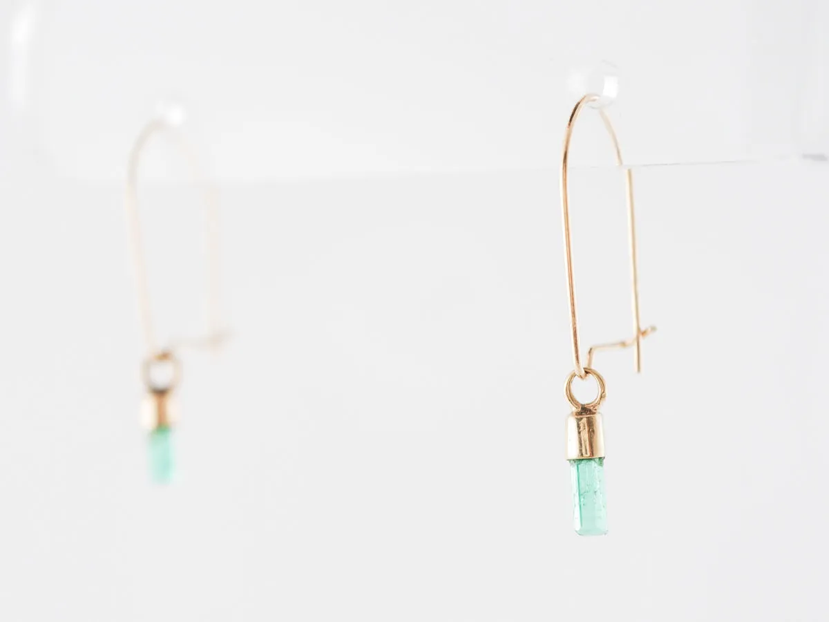 Delicate Emerald Dangle Earrings in 14k Yellow Gold