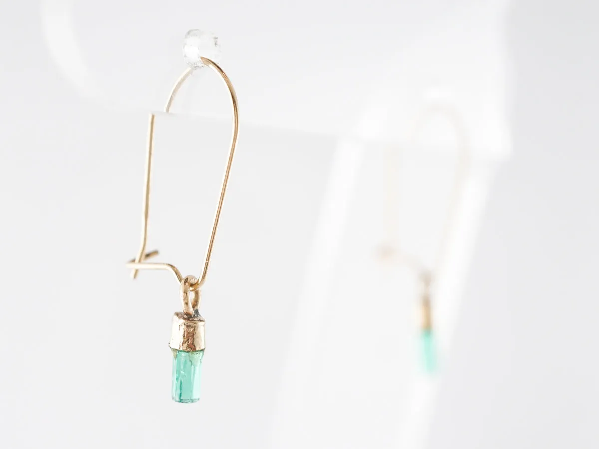 Delicate Emerald Dangle Earrings in 14k Yellow Gold