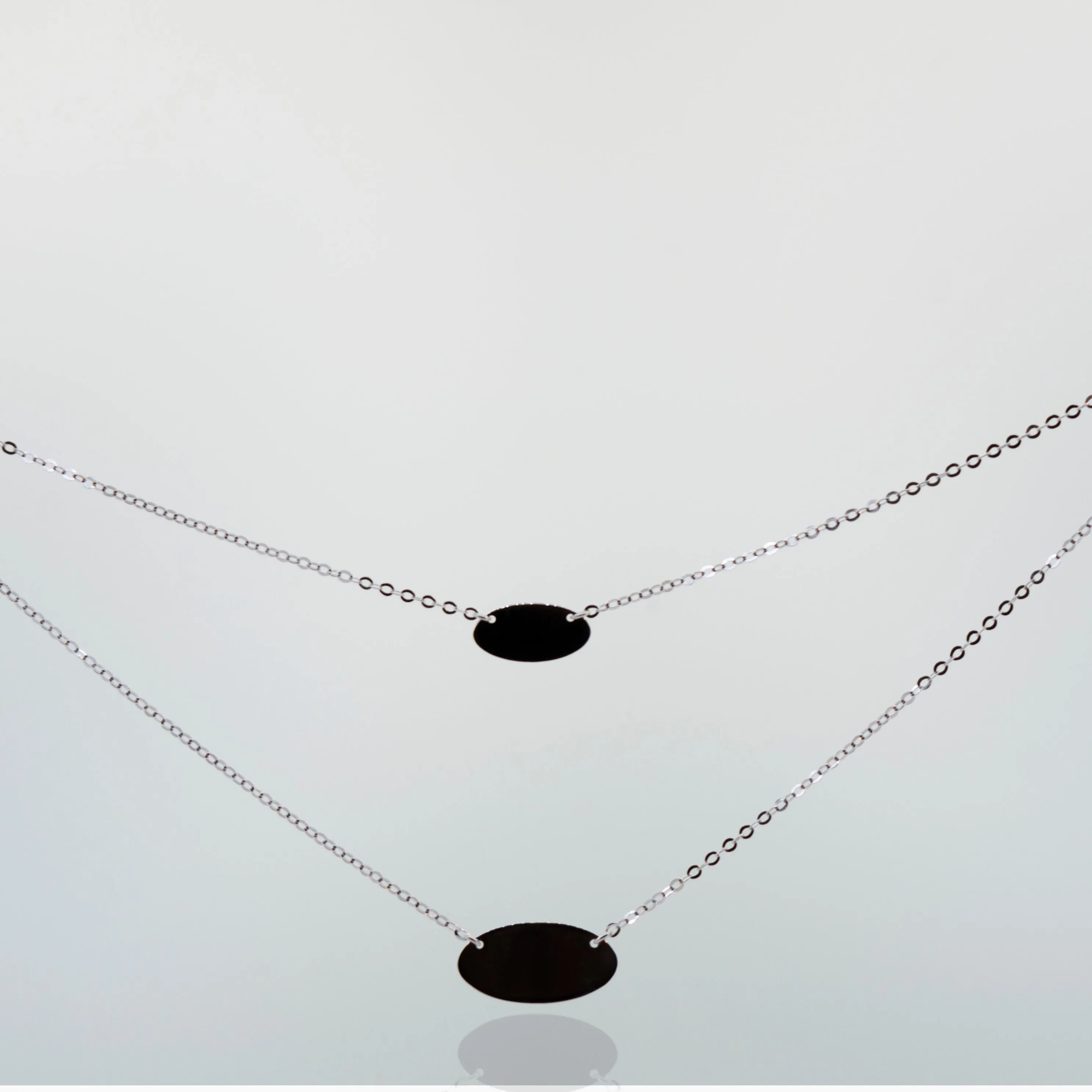 Elegant Sterling Silver Necklace with Two Oval Discs Pendants