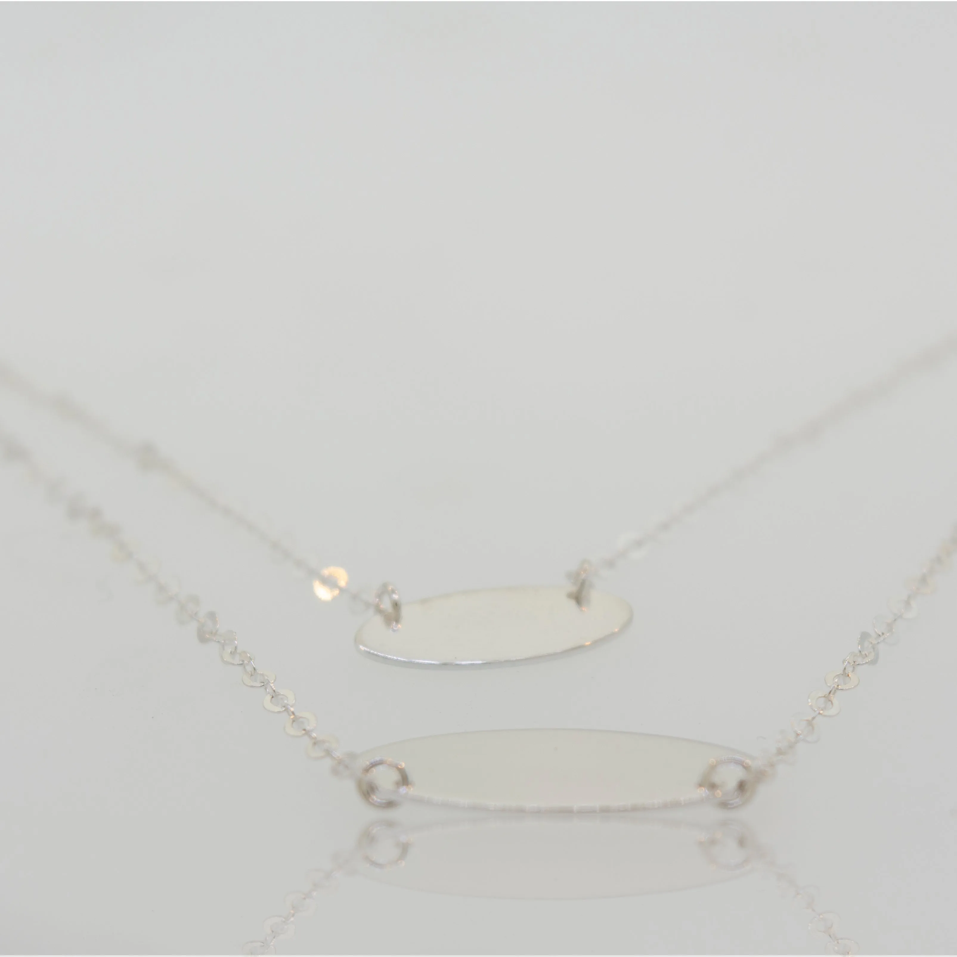 Elegant Sterling Silver Necklace with Two Oval Discs Pendants