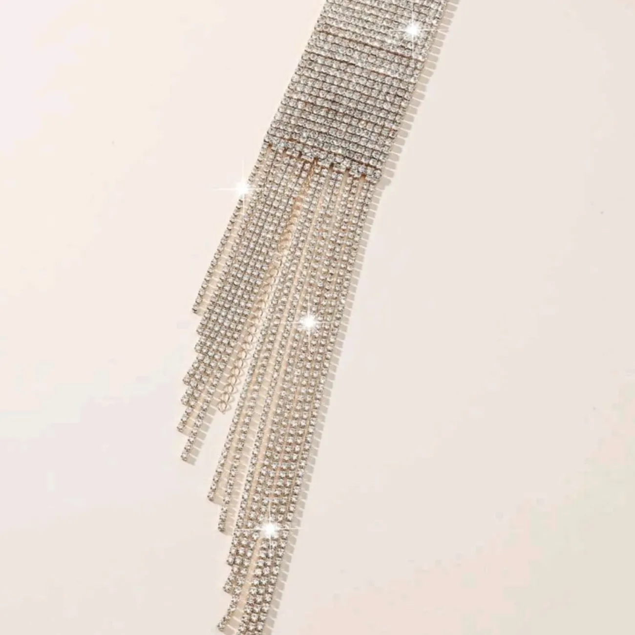 Rhinestone tassel wide bracelet.
